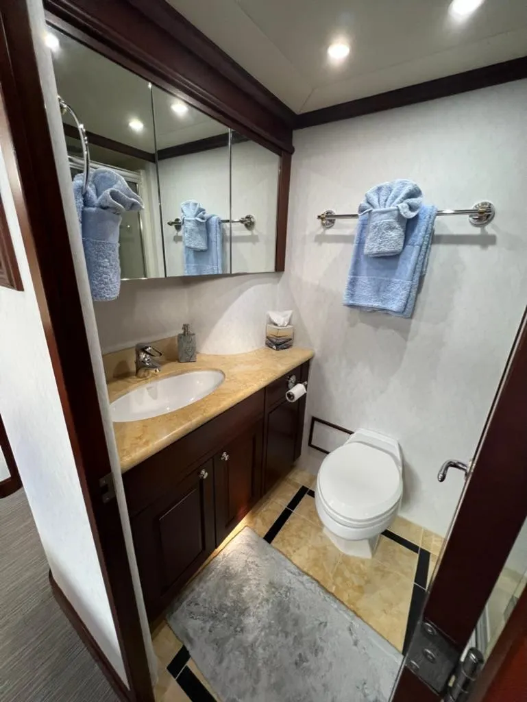 Slide: The Image of Luxurious bathroom in a 2005 Pacific Mariner 85 yacht with elegant fixtures and decor. - 40