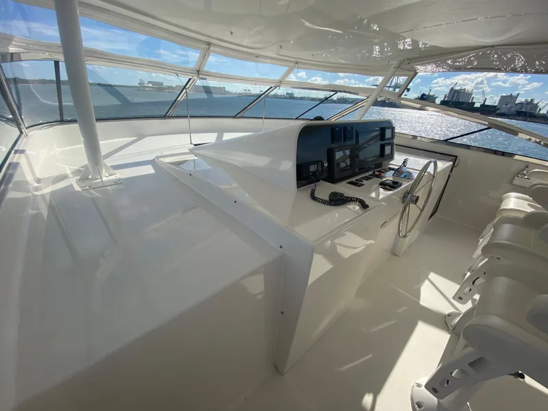 Slide: The Image of Helm of 2005 Pacific Mariner 85 yacht with modern navigation equipment and ocean view. - 45