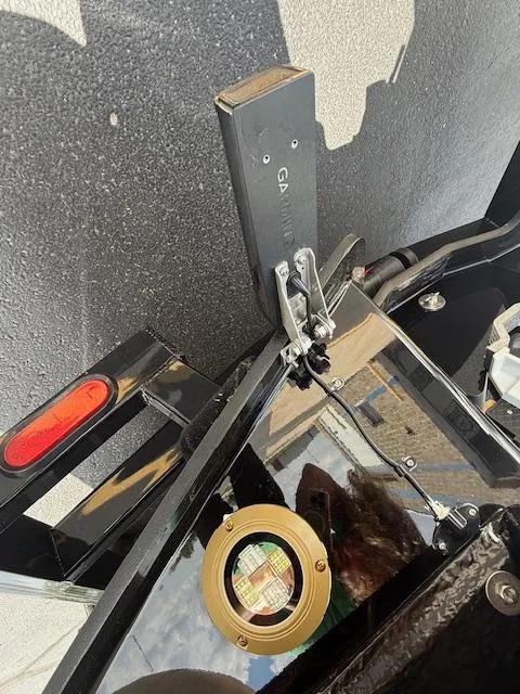 Slide: The Image of Close-up of 2025 Brig Eagle 8 boat equipment, featuring a Garmin device and a brass fitting. - 14