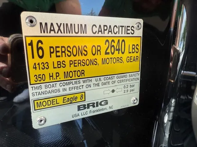 Slide: The Image of 2025 Brig Eagle 8 capacity plate: 16 persons, 2640 lbs, 350 HP motor. - 16