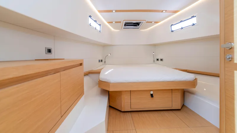 Slide: The Image of 2023 Pardo Yachts 38 on water, featuring triple outboard engines, clear skies, and lush shoreline. - 12