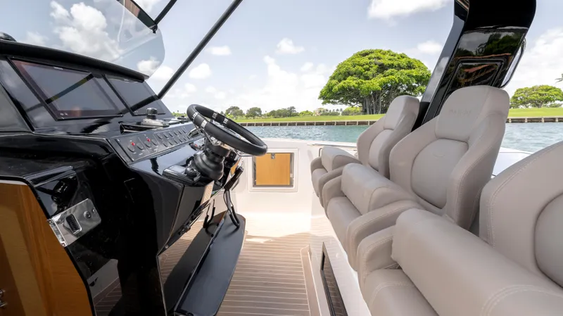 Slide: The Image of 2023 Pardo Yachts 38 luxury boat on calm water, showcasing sleek design and modern features. - 13