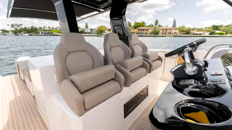 Slide: The Image of 2023 Pardo Yachts 38 luxury boat on calm water, sleek design, modern features. - 14