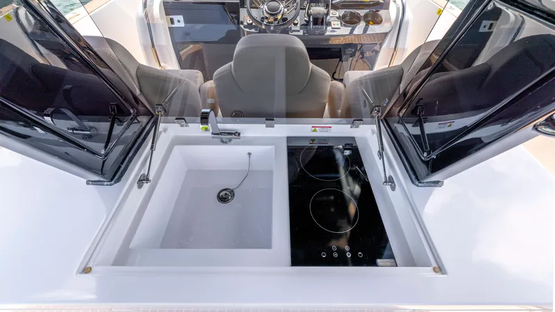 Slide: The Image of 2023 Pardo Yachts 38 on water, featuring sleek design and twin Mercury engines. - 15