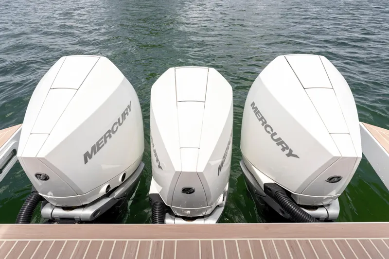 Slide: The Image of Triple Mercury outboard engines on 2023 Pardo Yachts 38, docked on water. - 20