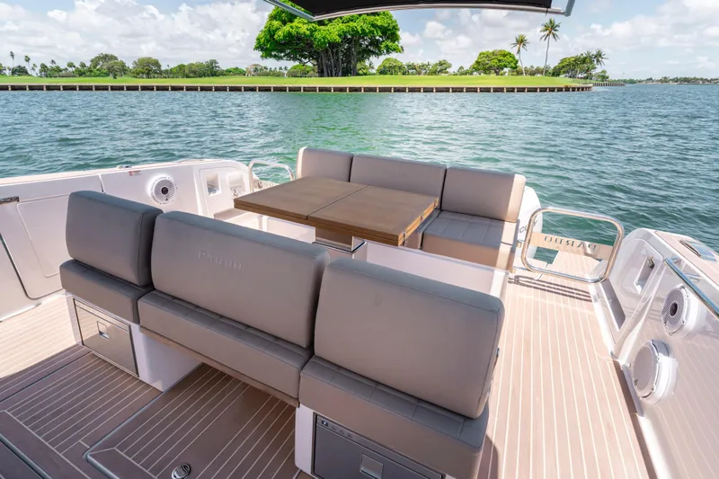 Slide: The Image of 2023 Pardo Yachts 38, luxurious seating area with scenic water view. - 26