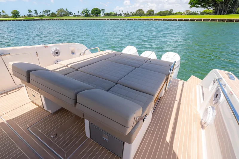 Slide: The Image of Luxury 2023 Pardo Yachts 38 with spacious sunbed on deck, overlooking serene waters. - 27