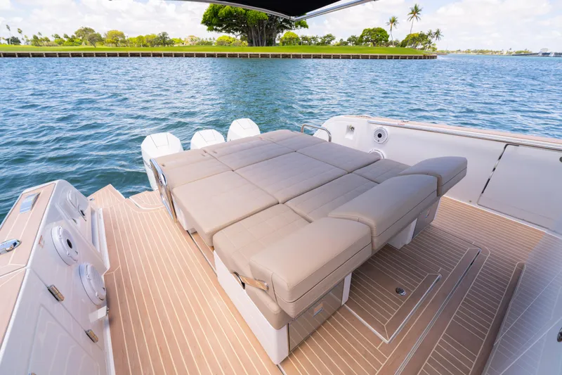 Slide: The Image of 2023 Pardo Yachts 38 with luxurious deck seating on calm waters. - 32