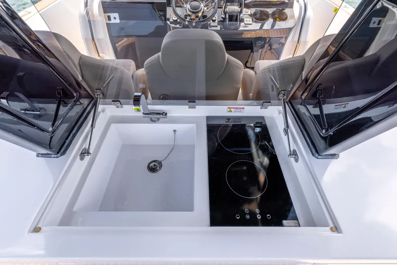 Slide: The Image of 2023 Pardo Yachts 38 interior with sink and stove in cockpit area. - 36