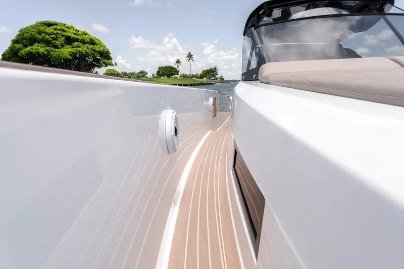 Slide: The Image of 2023 Pardo Yachts 38, sleek deck view with lush greenery and clear skies. - 45