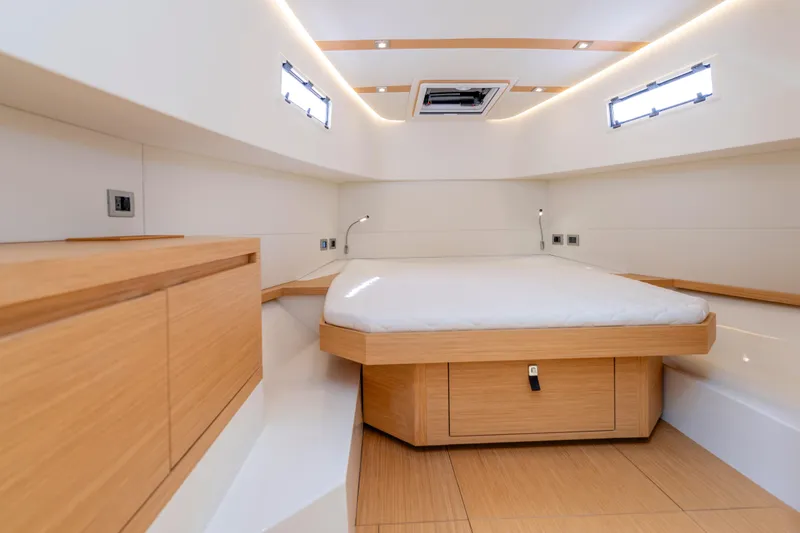 Slide: The Image of Luxurious interior cabin of 2023 Pardo Yachts 38, featuring modern wood finishes and ambient lighting. - 48
