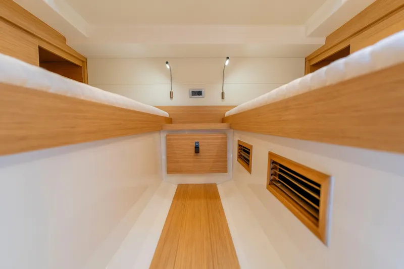 Slide: The Image of Interior of 2023 Pardo Yachts 38, featuring sleek wood finishes and modern lighting. - 60