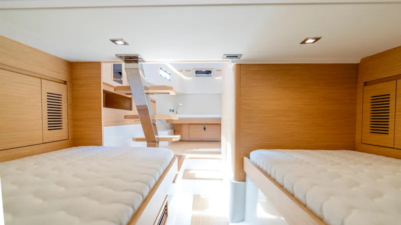Slide: The Image of Luxurious 2023 Pardo Yachts 38 deck with seating and table, featuring Mercury engines. - 9
