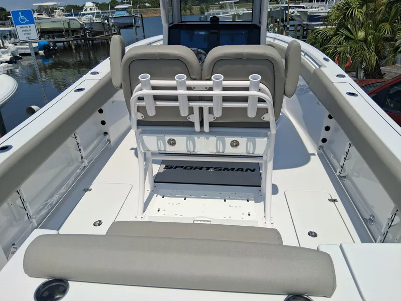 Slide: The Image of 2025 Sportsman Open 252 Center Console boat interior with seating and rod holders. - 4