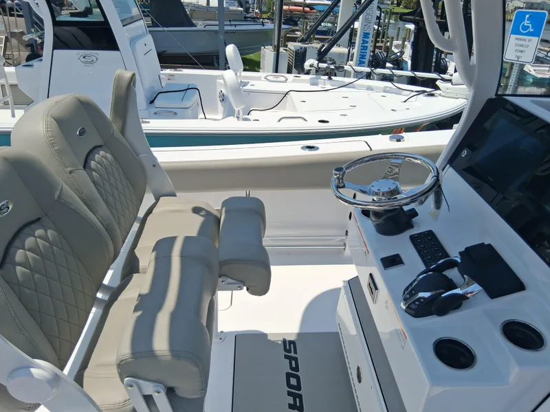 Slide: The Image of 2025 Sportsman Open 252 Center Console boat interior with helm and seating. - 7