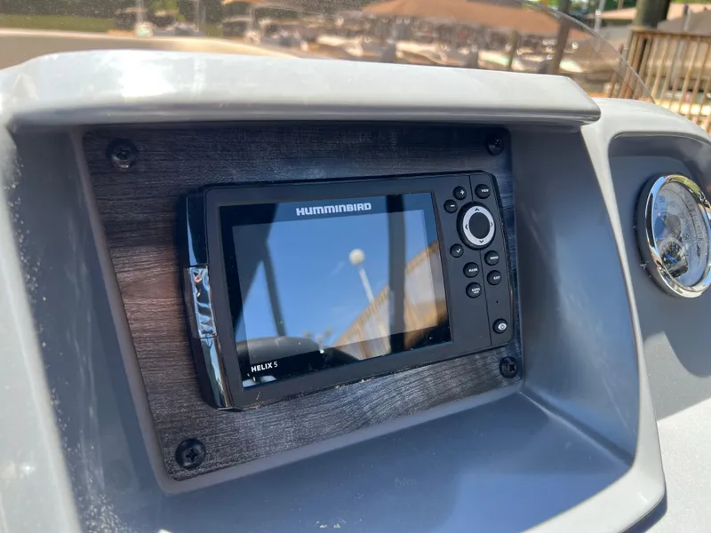 Slide: The Image of Helix 5 fish finder on 2025 Starcraft GX 22 R DH Sport boat dashboard. - 10