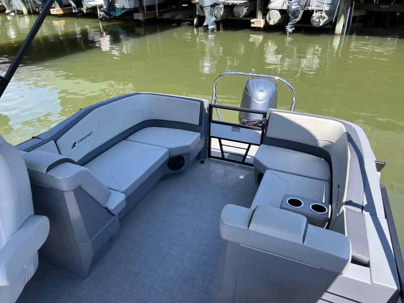 Slide: The Image of 2025 Starcraft GX 22 R DH Sport boat interior with seating and cup holders. - 14