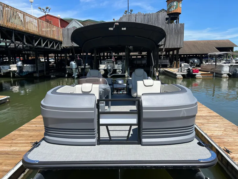 Slide: The Image of 2025 Starcraft GX 22 R DH Sport pontoon boat docked at a marina. - 4