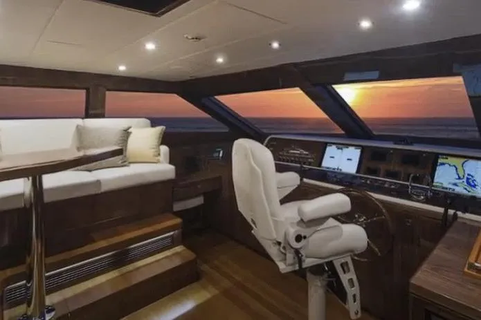 Slide: The Image of Luxurious 2017 Hargrave Raised Pilothouse MY interior with sunset view through large windows. - 12