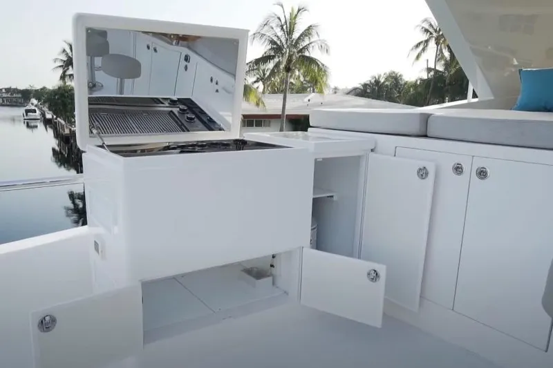 Slide: The Image of Outdoor kitchen on 2017 Hargrave Raised Pilothouse MY yacht with grill and storage cabinets. - 27