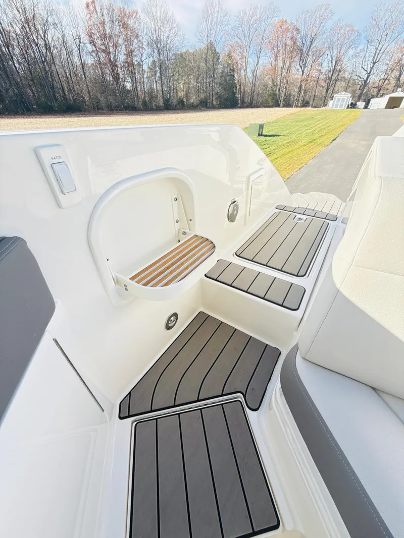 Slide: The Image of 2023 Sea Ray SLX 310 OB boat deck with sleek seating and modern design. - 21