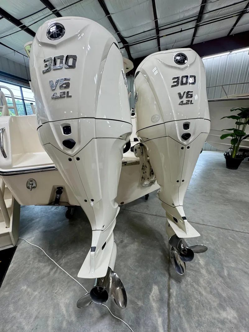 Slide: The Image of Twin 300 V6 4.2L outboard engines on a 2025 Grady-White Freedom 285 boat. - 3