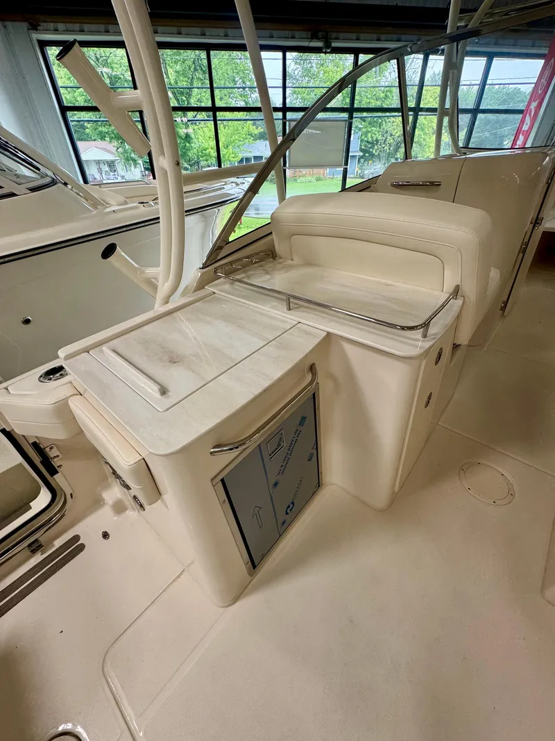 Slide: The Image of 2025 Grady-White Freedom 285 boat interior with seating and storage area. - 7