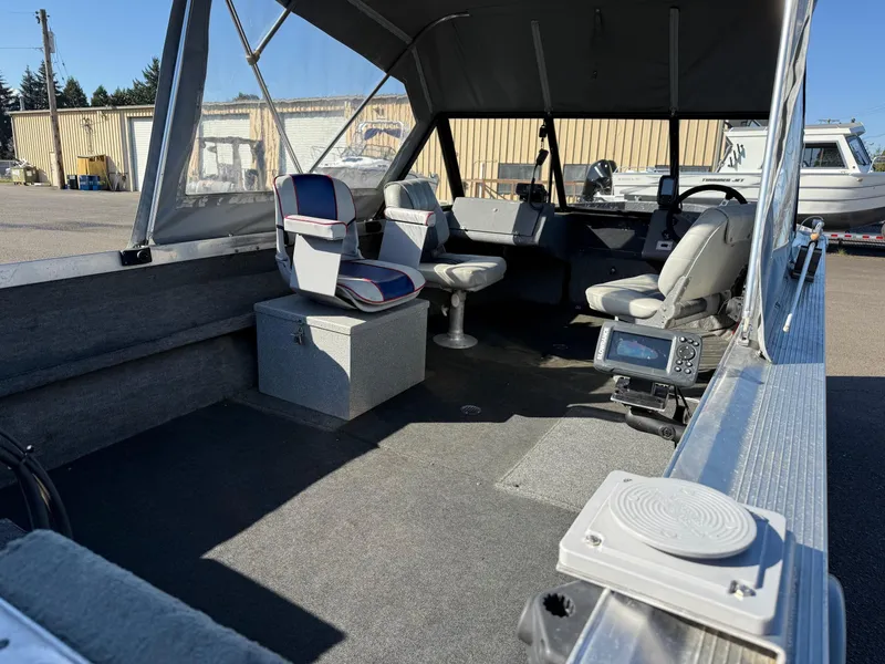 Slide: The Image of Interior of a 1987 Duckworth Pro Steelhead boat with seating and steering wheel. - 11