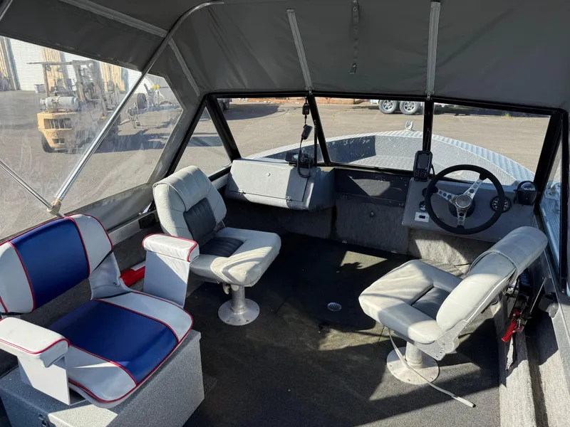 Slide: The Image of 1987 Duckworth Pro Steelhead boat dashboard with radio and microphone. - 15