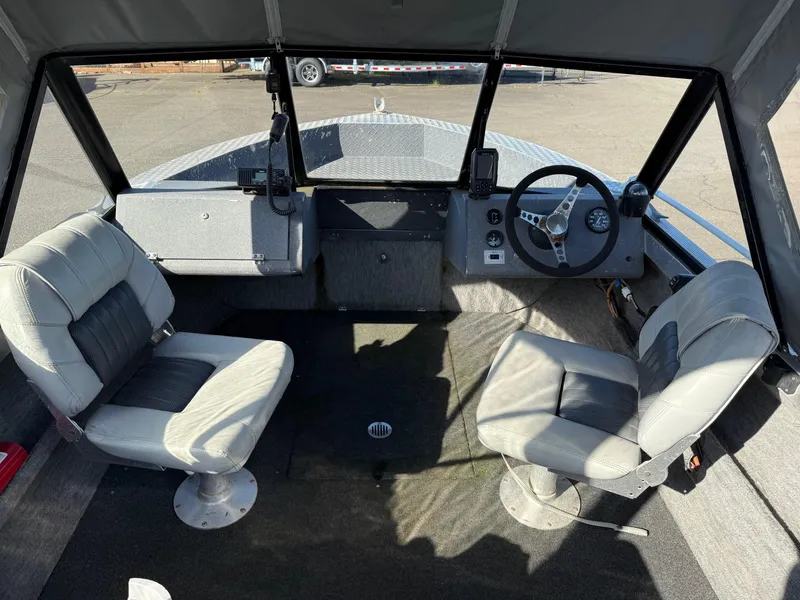 Slide: The Image of Trailer hitch and wheel of 1987 Duckworth Pro Steelhead boat on asphalt. - 17