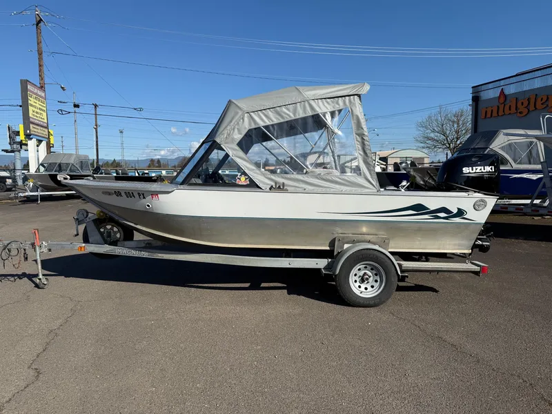 Slide: The Image of 1987 Duckworth Pro Steelhead boat with Mercury FourStroke engine on trailer. - 2