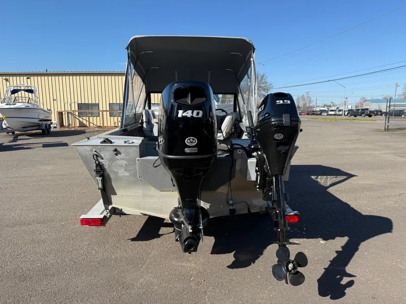 Slide: The Image of 1987 Duckworth Pro Steelhead boat with canopy on trailer, featuring Mercury outboard motor. - 4
