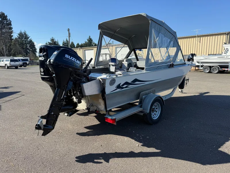 Slide: The Image of 1987 Duckworth Pro Steelhead boat with aluminum deck, parked outdoors. - 6