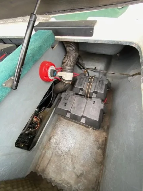Slide: The Image of 1995 Sea Ray 200 Signature boat battery compartment with wiring and ventilation. - 11