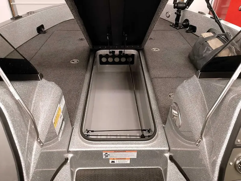 Slide: The Image of 2021 Triton 206 Allure boat interior with open storage compartment. - 16