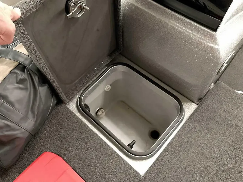 Slide: The Image of Storage compartment in 2021 Triton 206 Allure boat, featuring a secure latch and spacious interior. - 17