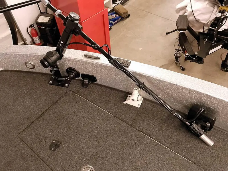 Slide: The Image of 2021 Triton 206 Allure boat deck with mounted fishing rod holder. - 19