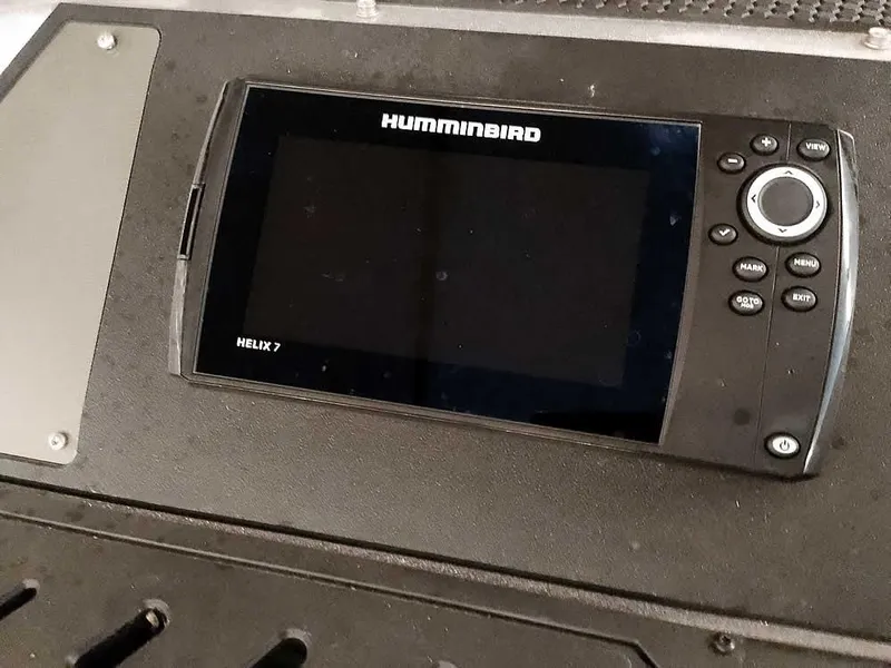 Slide: The Image of Humminbird Helix 7 fish finder on 2021 Triton 206 Allure boat dashboard. - 23