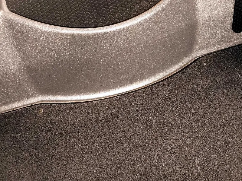 Slide: The Image of Interior detail of a 2021 Triton 206 Allure, featuring textured surfaces and sleek design elements. - 28