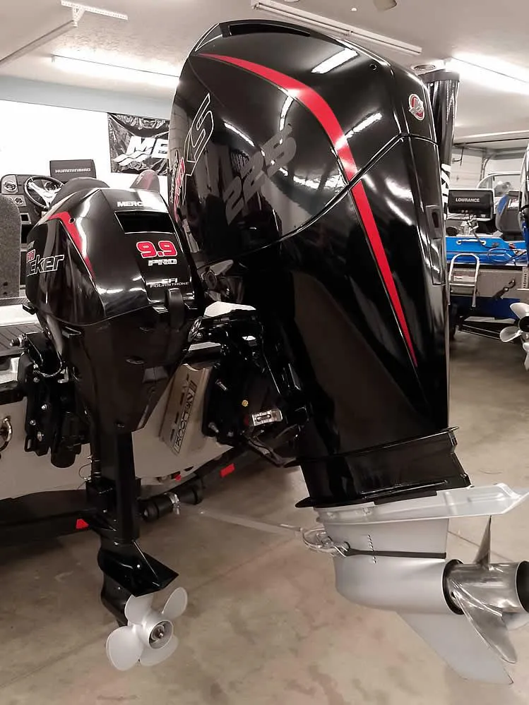 Slide: The Image of 2021 Triton 206 Allure boat with powerful outboard motor in showroom. - 3