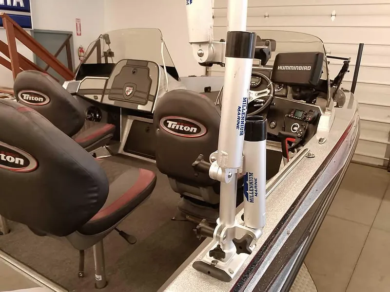 Slide: The Image of 2021 Triton 206 Allure boat interior with seats and Humminbird electronics. - 36