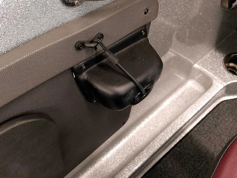 Slide: The Image of 2021 Triton 206 Allure boat interior detail with storage compartment and textured finish. - 38