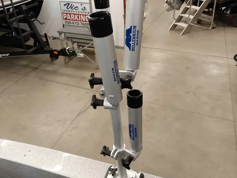 Slide: The Image of Rod holders on a 2021 Triton 206 Allure boat in a showroom setting. - 39