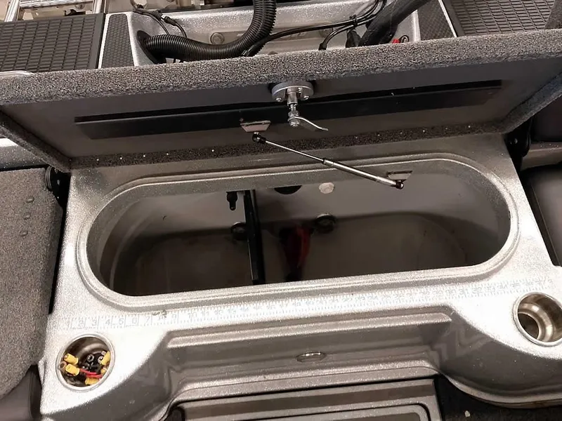 Slide: The Image of Open storage compartment in a 2021 Triton 206 Allure boat. - 46