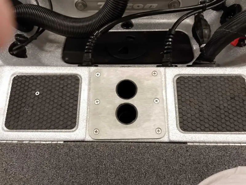 Slide: The Image of 2021 Triton 206 Allure boat interior with dual cup holders and textured footrests. - 47