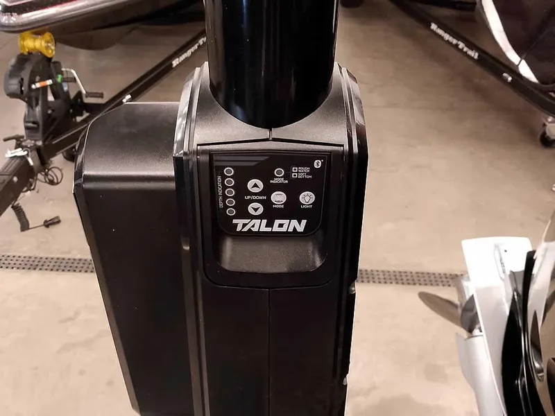 Slide: The Image of Talon anchor system on a 2021 Triton 206 Allure boat, featuring control panel and settings. - 49