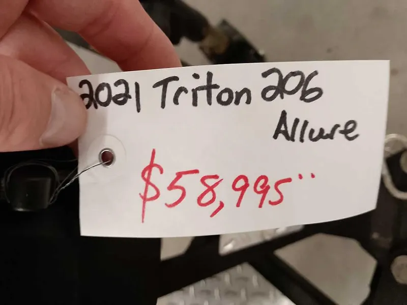 Slide: The Image of Price tag for 2021 Triton 206 Allure, listed at $58,995. - 5