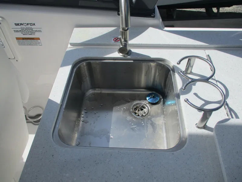 Slide: The Image of Stainless steel sink on 2025 Sea Fox 288 Traveler boat with cup holders. - 11