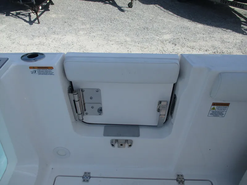 Slide: The Image of 2025 Sea Fox 288 Traveler boat interior, featuring a white cushioned seat and stainless steel hardware. - 12