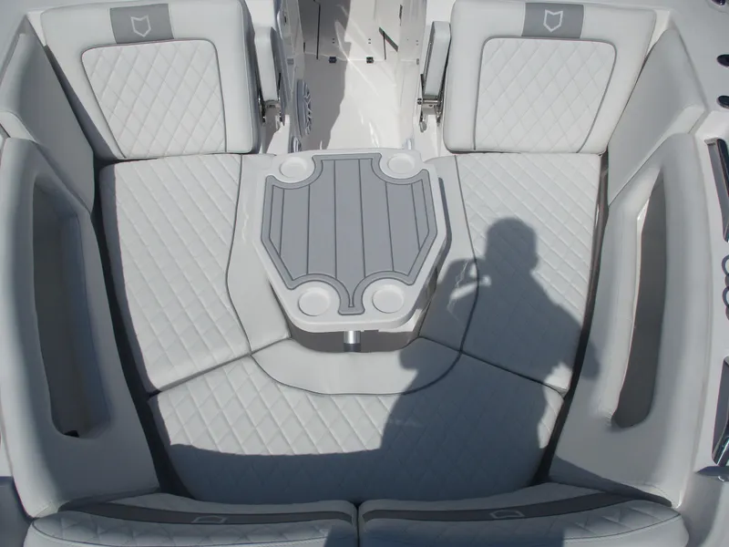 Slide: The Image of 2025 Sea Fox 288 Traveler boat interior with cushioned seating and table. - 17